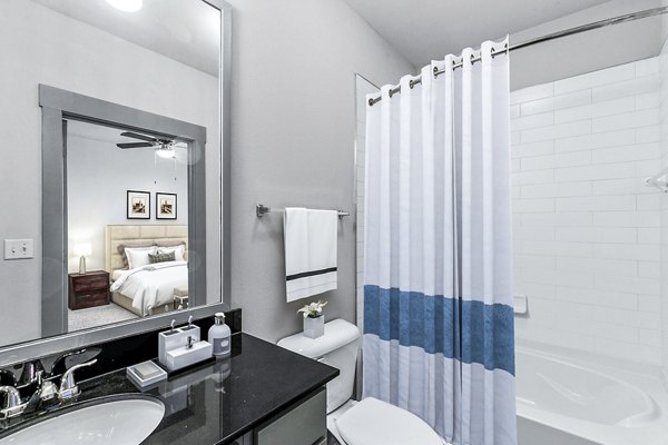 Modern bathroom with sleek fixtures and marble countertops at Landmark on Lovers Apartments