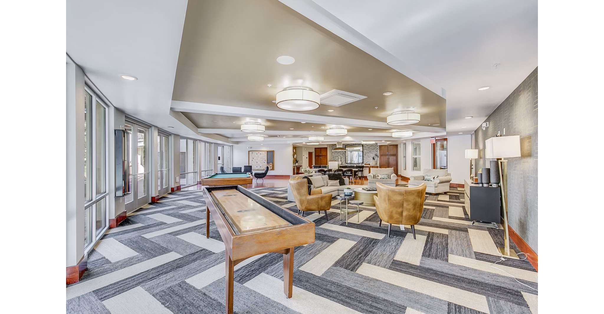 Vibrant game room with pool table and seating at Landmark on Lovers Apartments