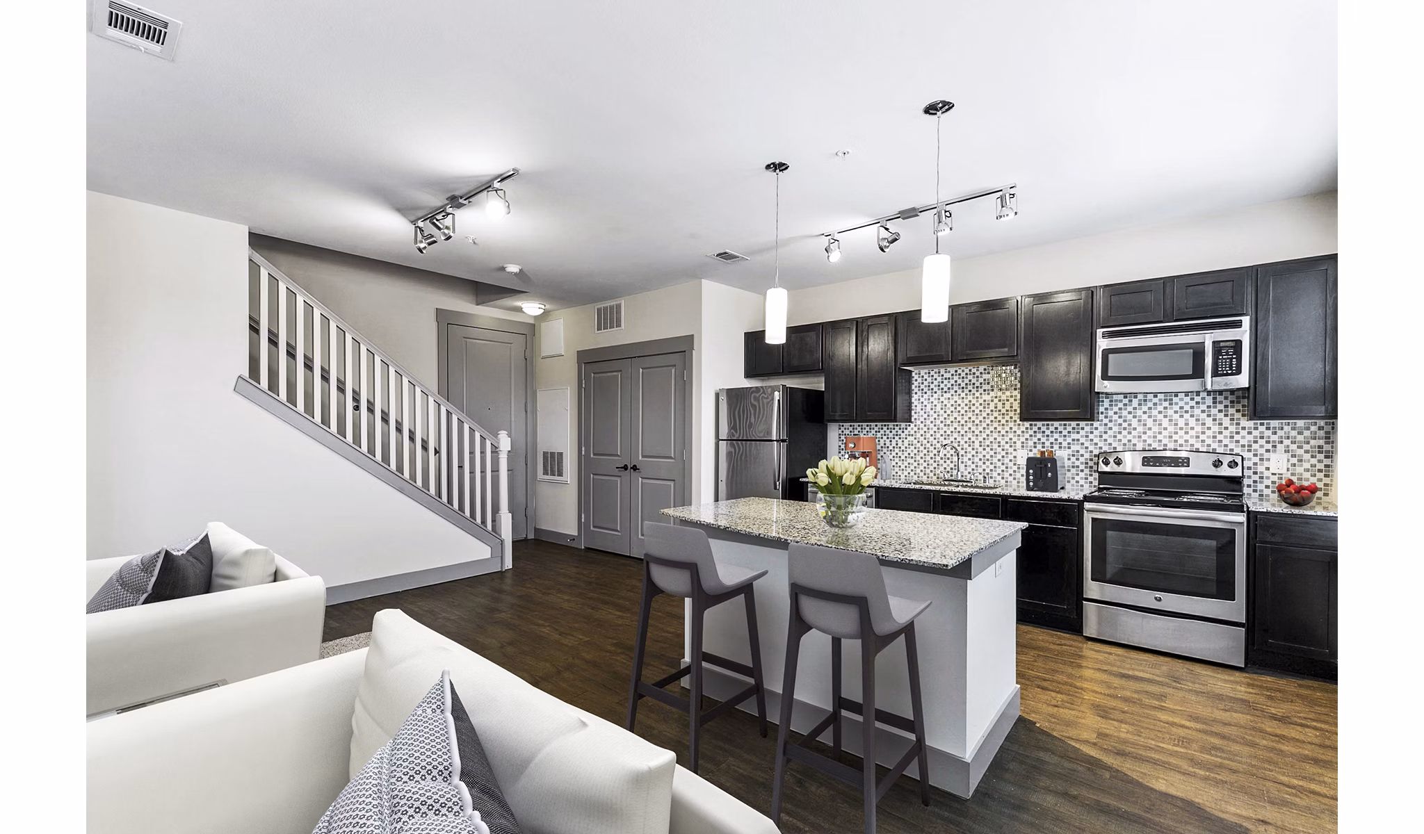 Modern kitchen with stainless steel appliances at Landmark on Lovers Apartments