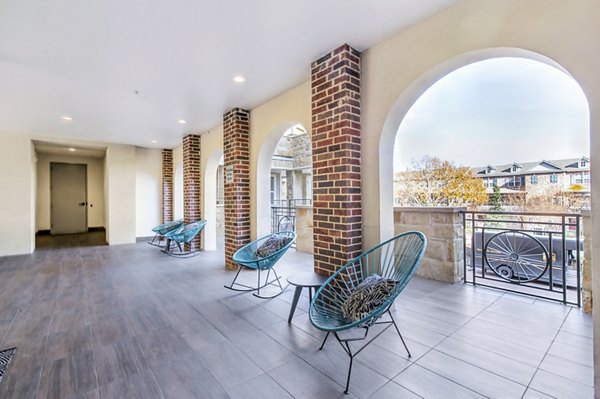 Cozy patio with garden views at Landmark on Lovers Apartments, perfect for relaxation