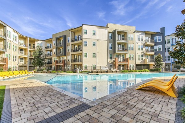Spacious outdoor pool at Landmark on Lovers Apartments offering luxury leisure facilities