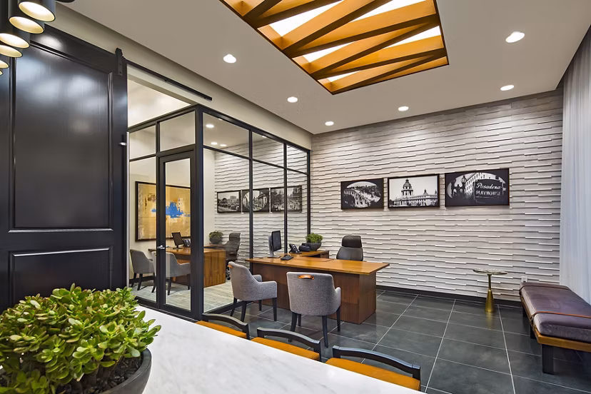 Modern clubhouse featuring cozy seating and fireplace at The Hudson Apartments