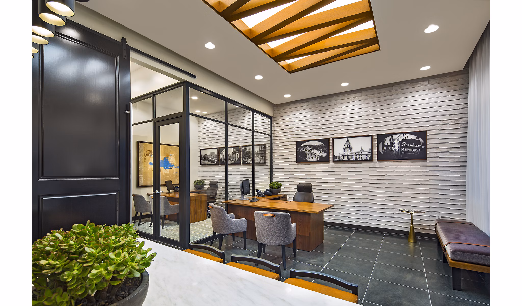 Modern clubhouse featuring cozy seating and fireplace at The Hudson Apartments