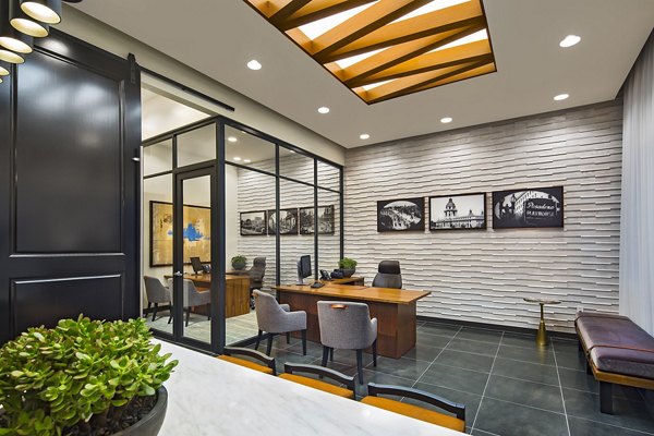Modern clubhouse featuring cozy seating and fireplace at The Hudson Apartments