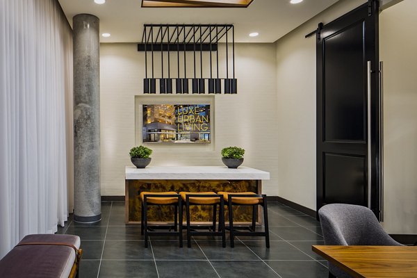 Clubhouse with modern amenities at The Hudson Apartments Spacious space designed for community events and relaxation