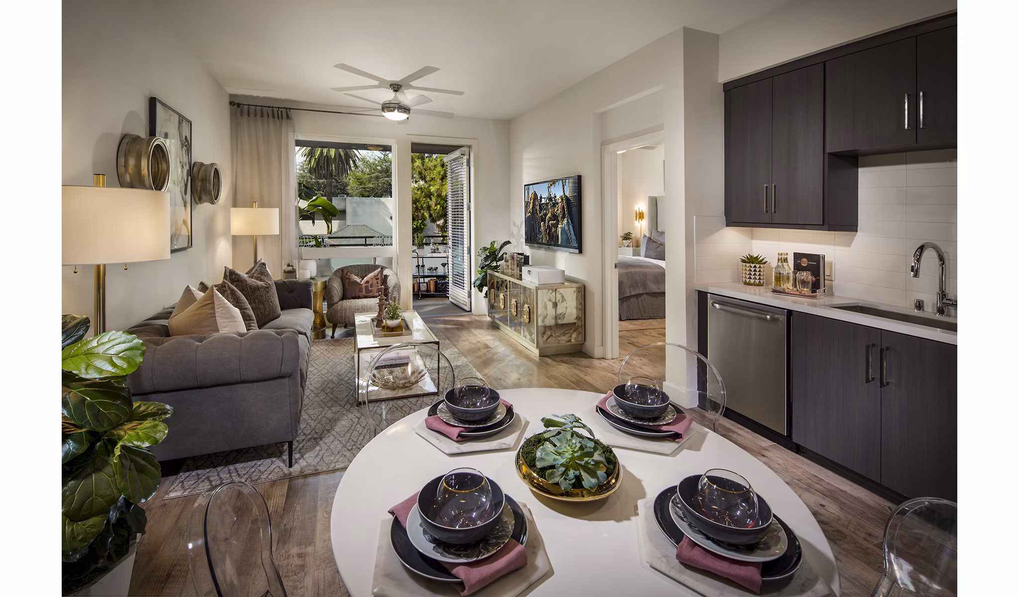 The Hudson Apartments: Elegant dining room with modern furnishings and stylish lighting in luxury Greystar community
