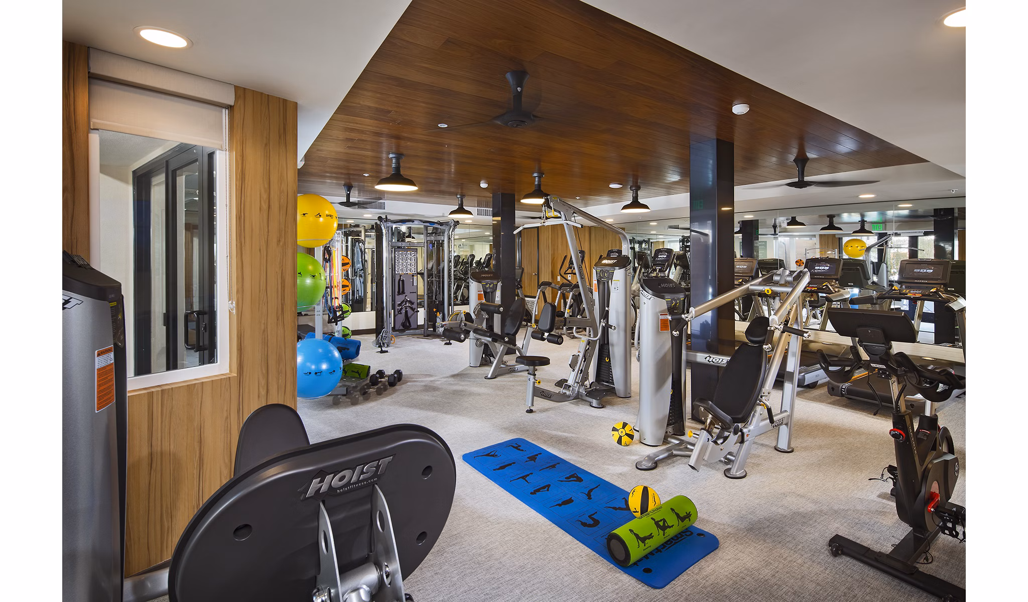 Fitness center with modern equipment at The Hudson Apartments