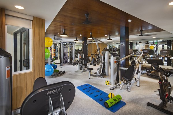 Fitness center with modern equipment at The Hudson Apartments