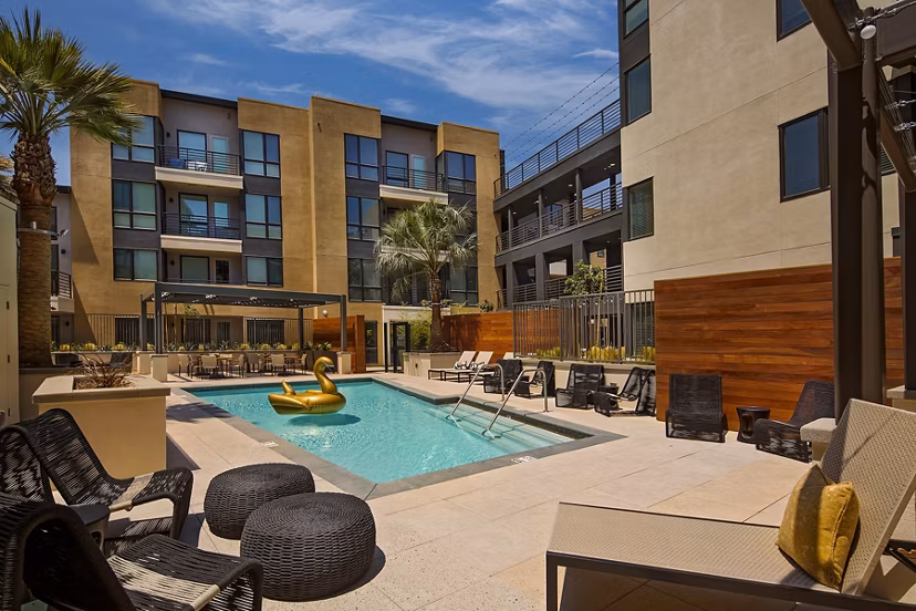 Modern pool with lounge chairs at The Hudson Apartments, luxury living in the city center