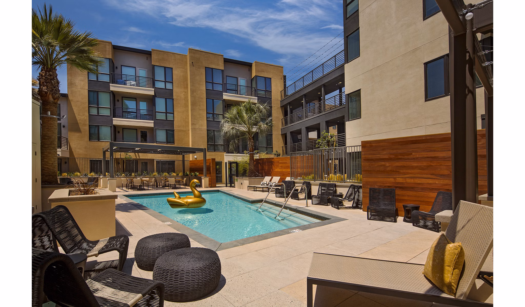 Modern pool with lounge chairs at The Hudson Apartments, luxury living in the city center