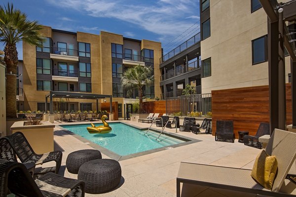 Modern pool with lounge chairs at The Hudson Apartments, luxury living in the city center