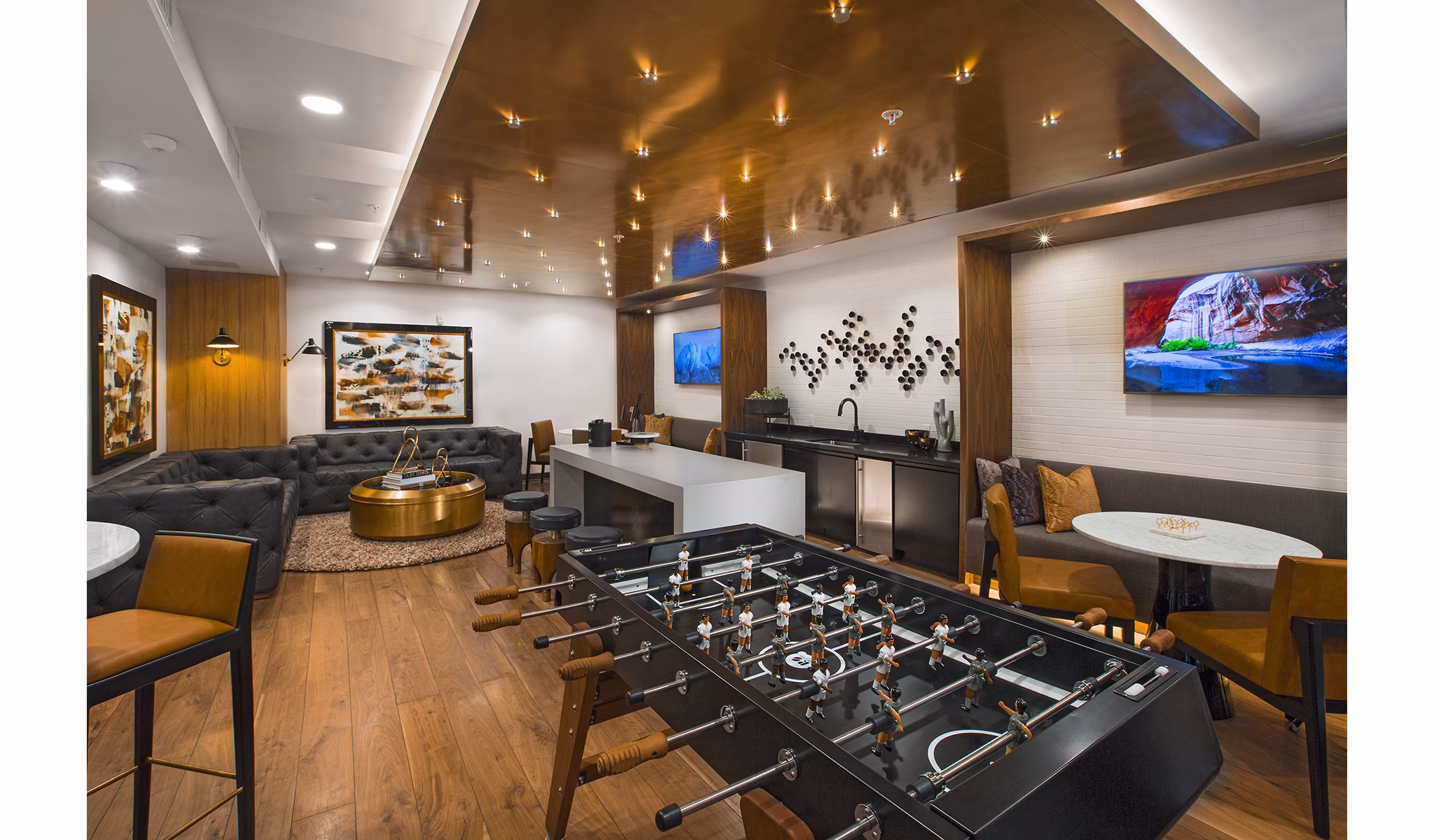 Game room with pool table and arcade games at The Hudson Apartments