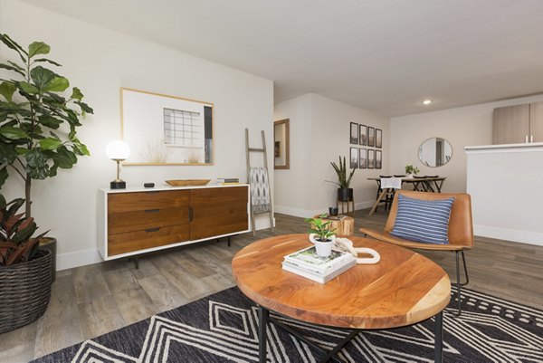 Spacious living room with modern decor at Brookside 112 Apartments featuring luxury finishes