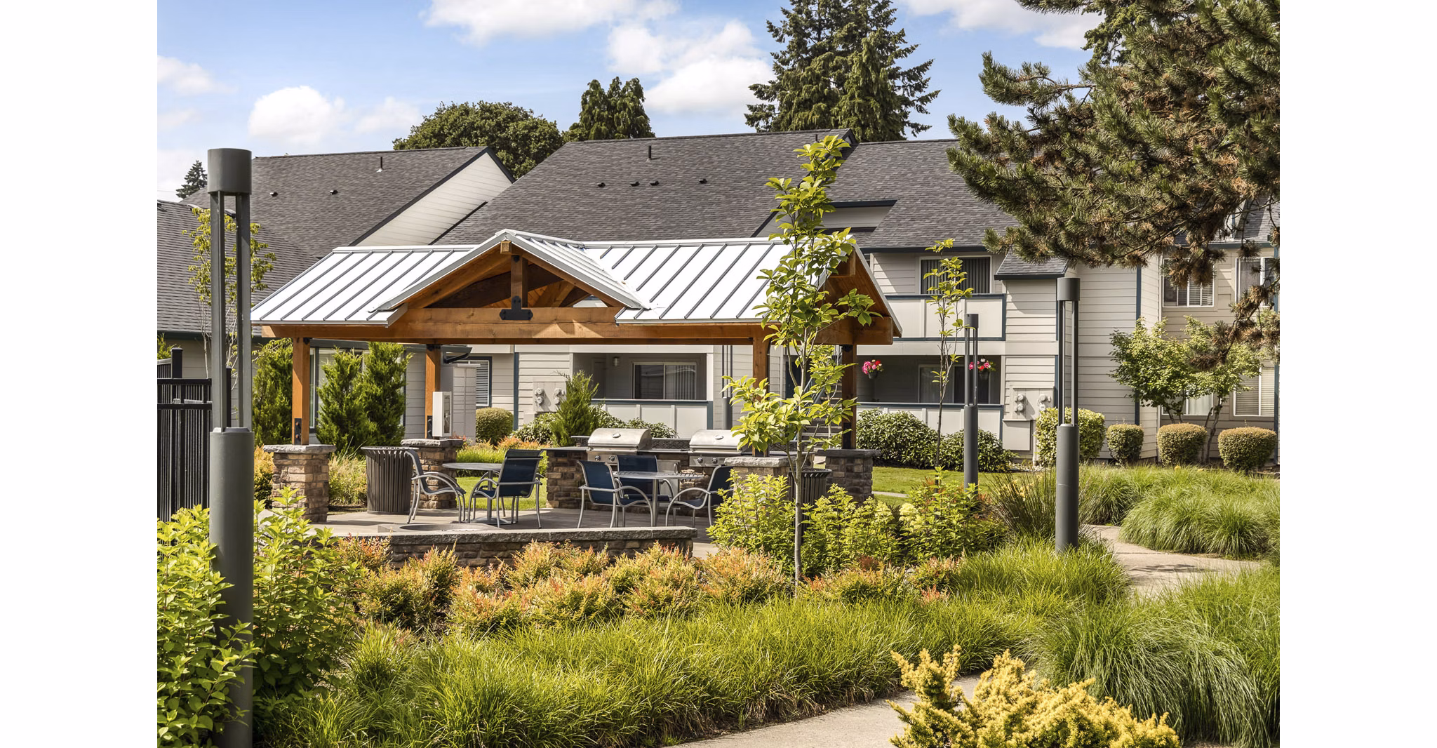 Outdoor grill area at Brookside 112 Apartments, perfect for social gatherings and summer BBQs in this luxury community