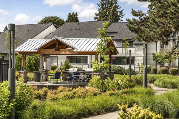 Outdoor grill area at Brookside 112 Apartments, perfect for social gatherings and summer BBQs in this luxury community