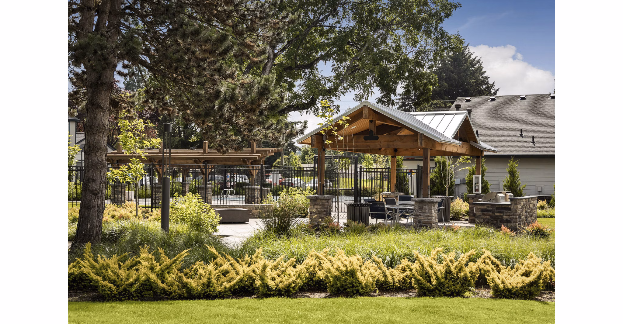 Outdoor grill area with modern seating at Brookside 112 Apartments, ideal for entertaining and relaxation