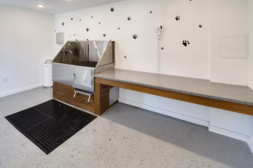 Dog wash station at Brookside 112 Apartments offering pet care amenities for luxury living