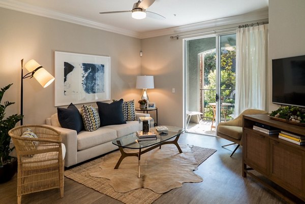 Spacious living room with modern decor at Amerige Pointe Apartments