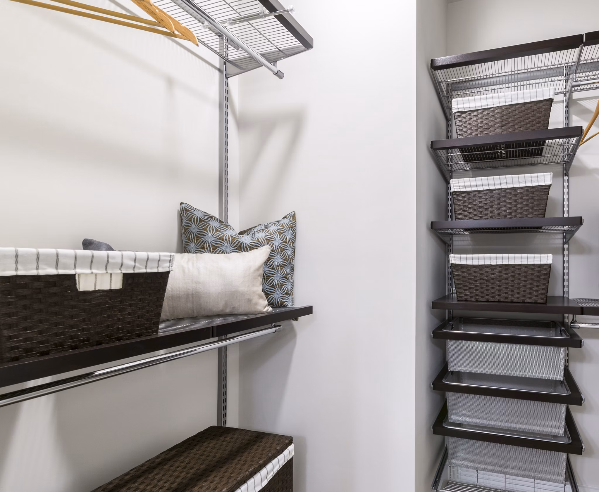Walk-in closet with ample shelving in Overture Fair Ridge Apartments