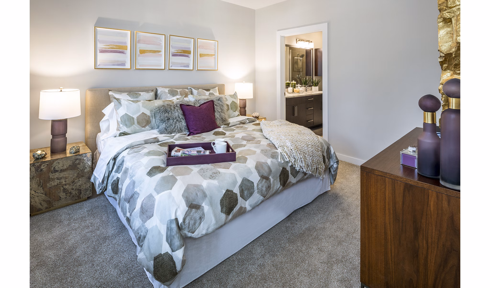 Cozy bedroom featuring a plush bed, stylish nightstands, and elegant artwork on the walls