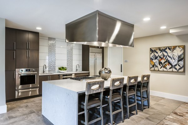 Elegant clubhouse with modern decor at Overture Fair Ridge Apartments, ideal for social gatherings and community events