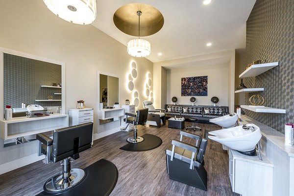 Elegant salon with plush seating and modern decor at Overture Fair Ridge Apartments