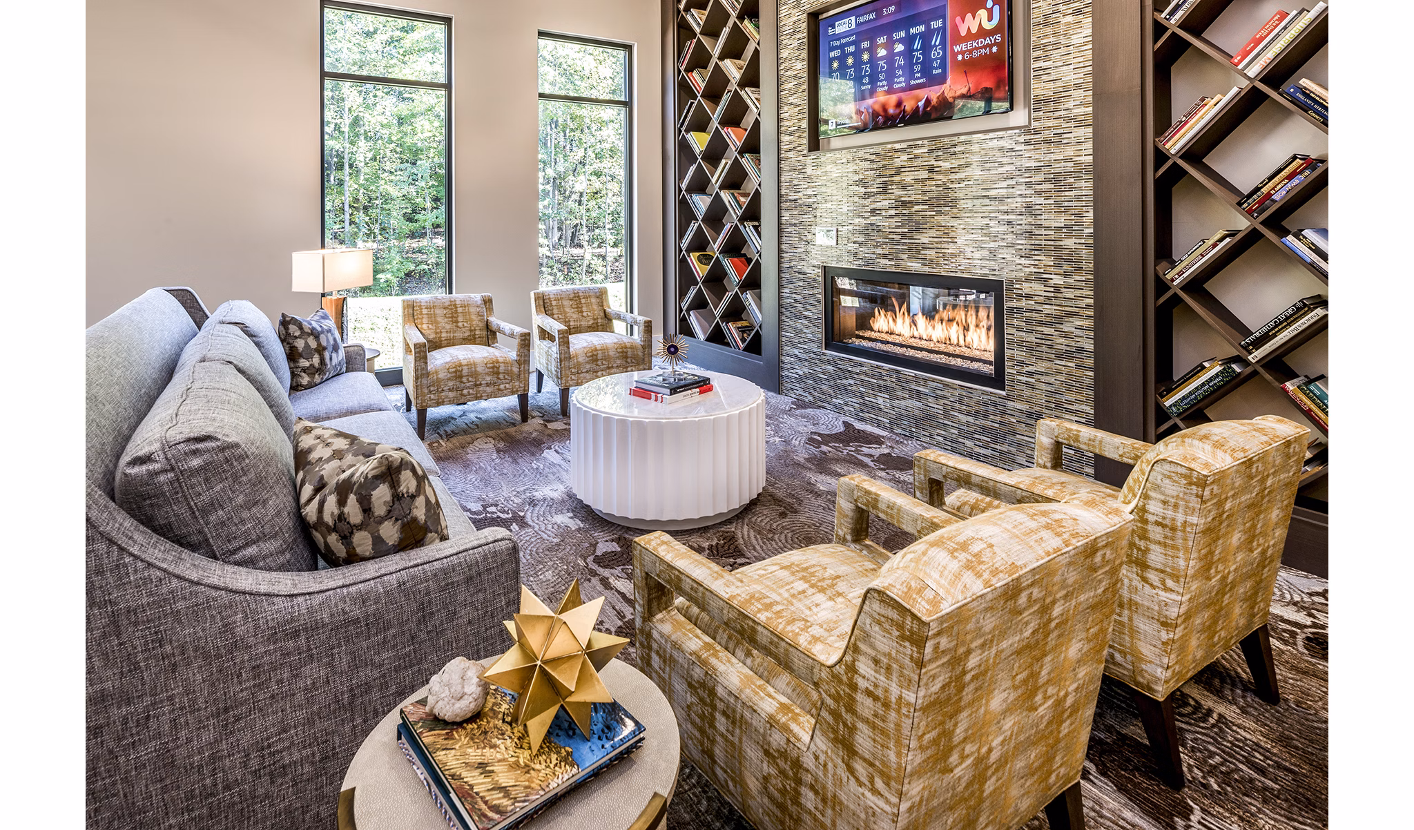 Modern living room with a cozy fireplace and stylish furniture in luxury apartments