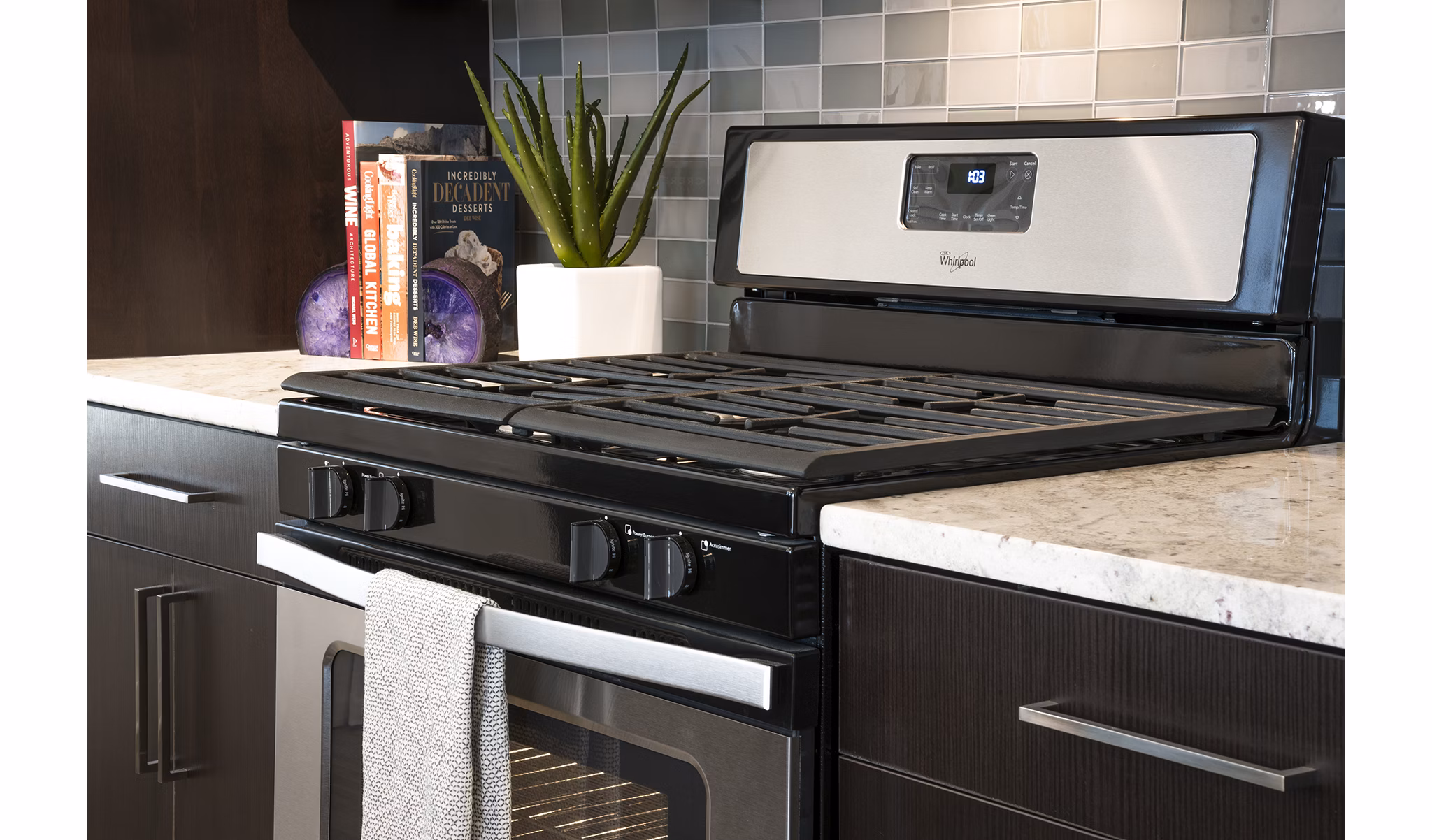 Modern kitchen with stainless steel appliances in Greystar luxury apartments