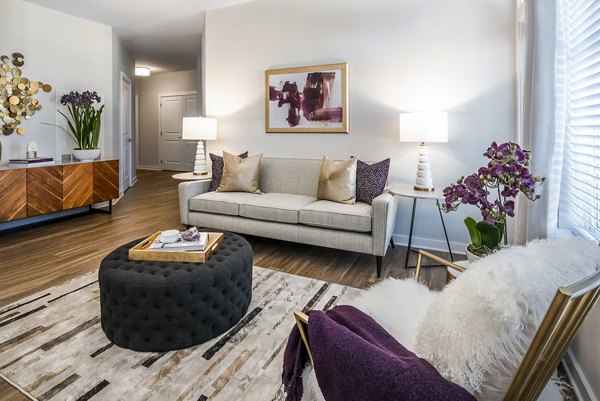 Spacious living room with modern decor in Overture Fair Ridge Apartments