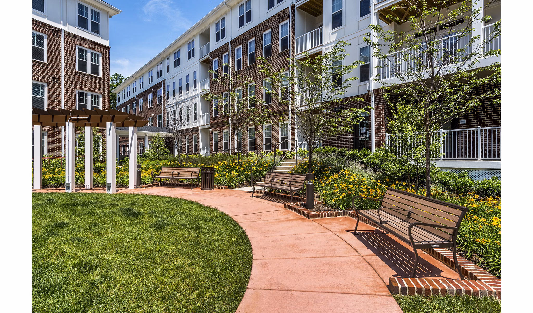 Courtyard featuring landscaped gardens at Overture Fair Ridge Apartments, luxury living with serene outdoor spaces