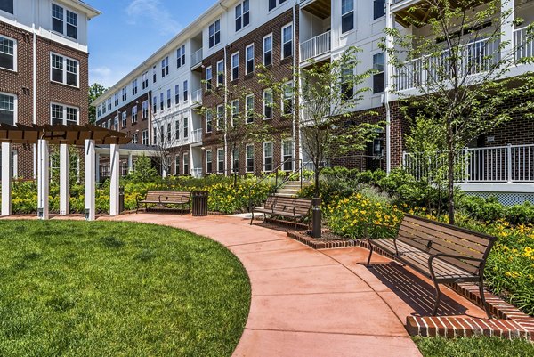 Courtyard featuring landscaped gardens at Overture Fair Ridge Apartments, luxury living with serene outdoor spaces