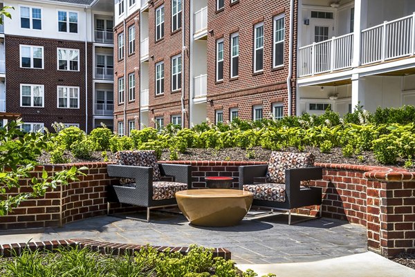 Cozy outdoor fire pit area at Overture Fair Ridge Apartments, perfect for relaxation and social gatherings