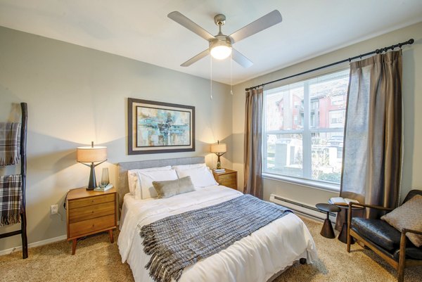 Elegant bedroom with modern decor at Avana One Six Four Apartments