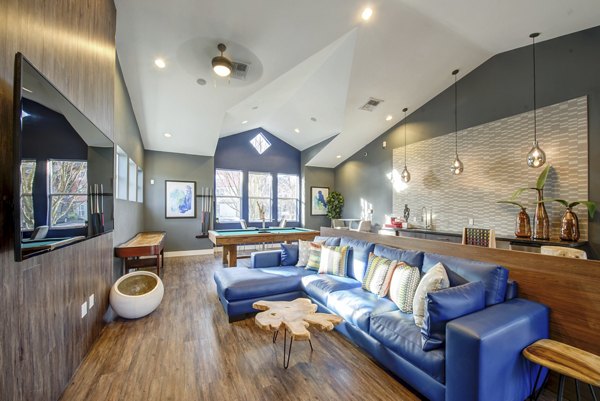 Stylish clubhouse featuring modern furnishings at Avana One Six Four Apartments