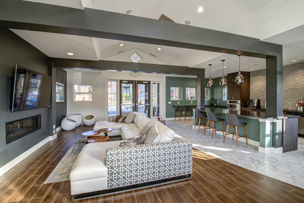 Clubhouse featuring modern decor and seating at Avana One Six Four Apartments