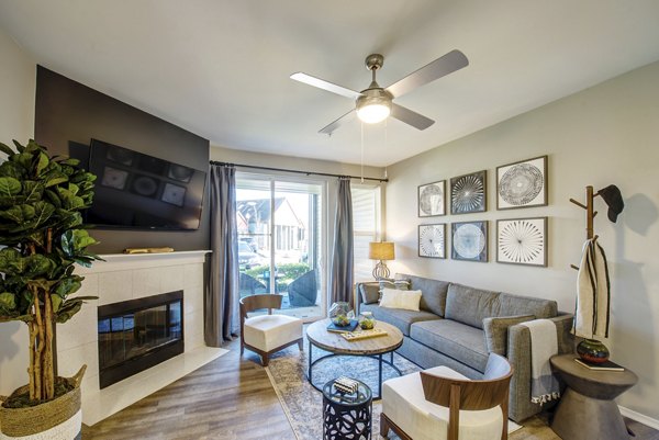 Living room featuring modern decor and natural light at Avana One Six Four Apartments