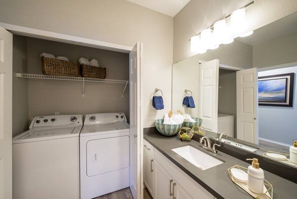 laundry room at Avana One Six Four Apartments