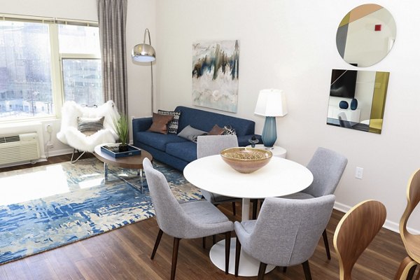 Dining room with elegant decor and modern lighting at 3 Journal Square Apartments, a luxury Greystar-managed property in a vibrant community
