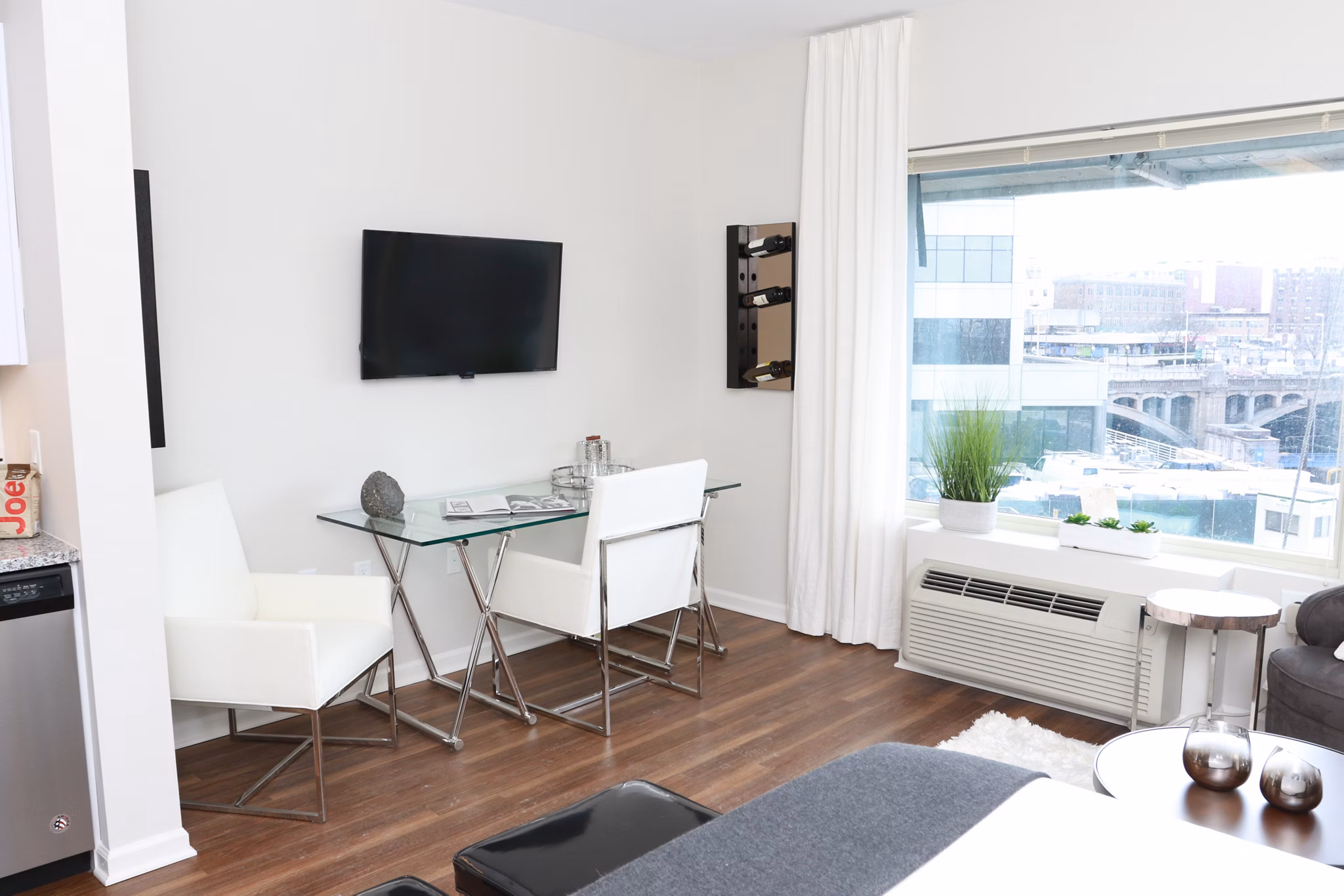 Contemporary kitchen with stainless steel appliances at 3 Journal Square Apartments