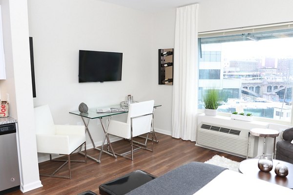 Contemporary kitchen with stainless steel appliances at 3 Journal Square Apartments