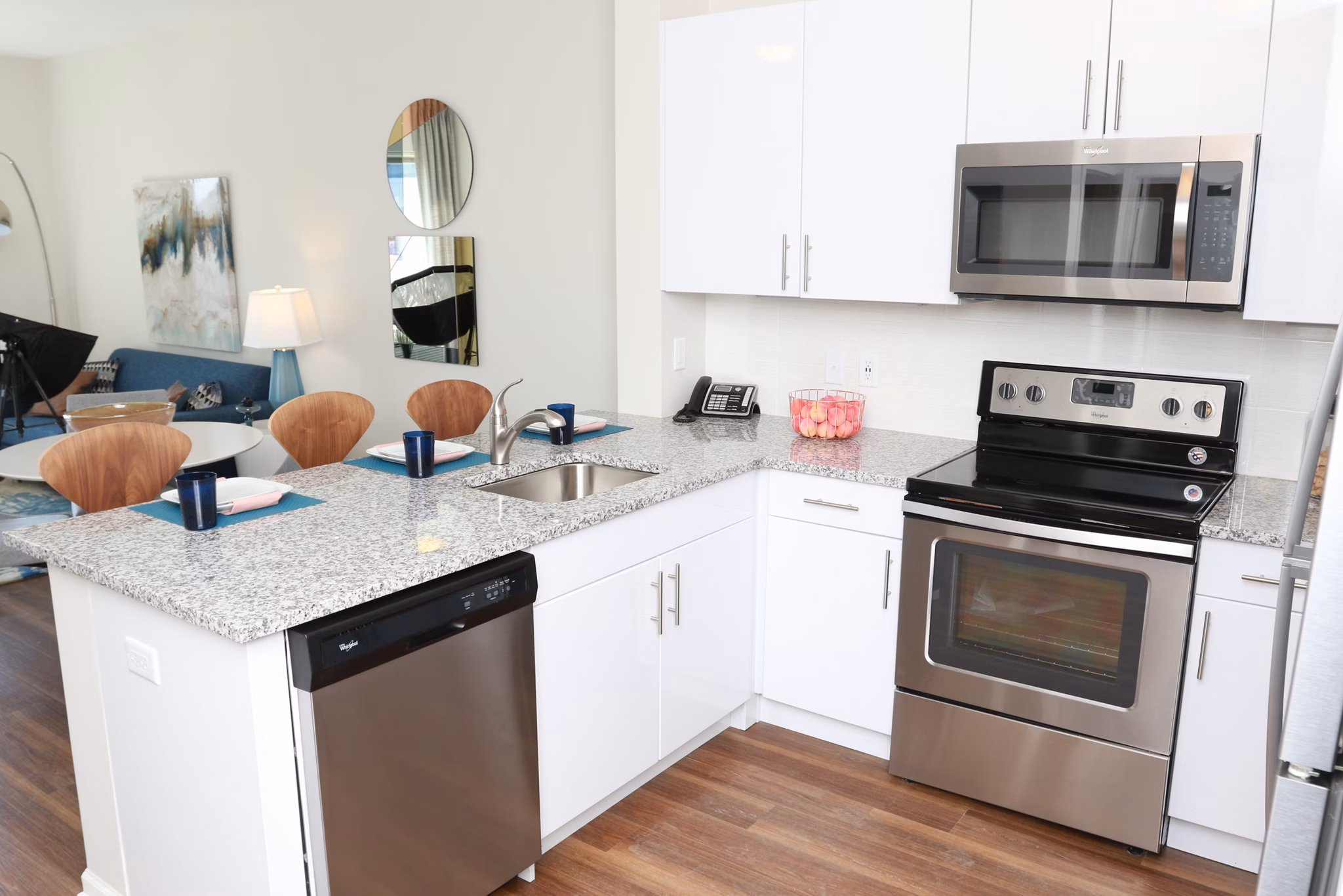 Kitchen featuring modern appliances and sleek countertops at 3 Journal Square Apartments