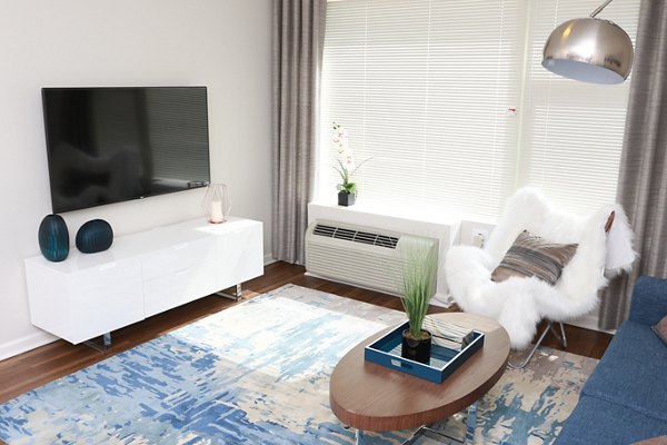 Spacious living room with modern decor in 3 Journal Square Apartments, Jersey City Perfect for hosting guests and relaxing in style
