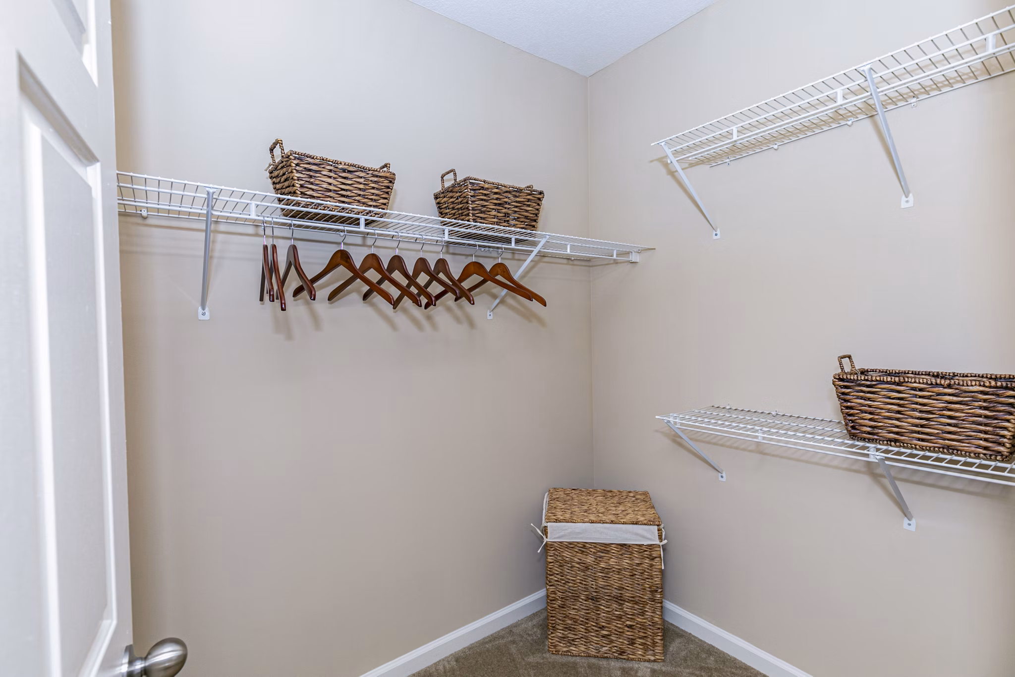 Andover at Johns Creek: Modern bedroom closet with built-in shelving and ample storage in Greystar's luxury apartments