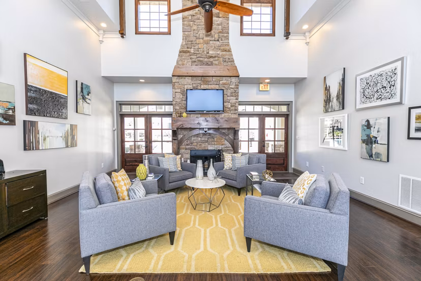 Clubhouse featuring modern design and spacious seating at Andover at Johns Creek Apartments