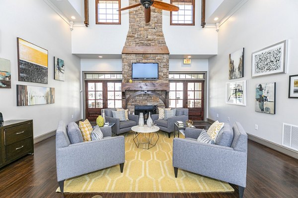 Clubhouse featuring modern design and spacious seating at Andover at Johns Creek Apartments