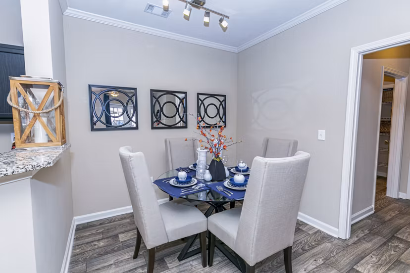 Dining room featuring elegant decor and modern furnishings at Andover at Johns Creek Apartments