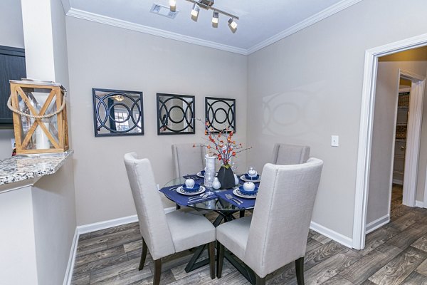 Dining room featuring elegant decor and modern furnishings at Andover at Johns Creek Apartments