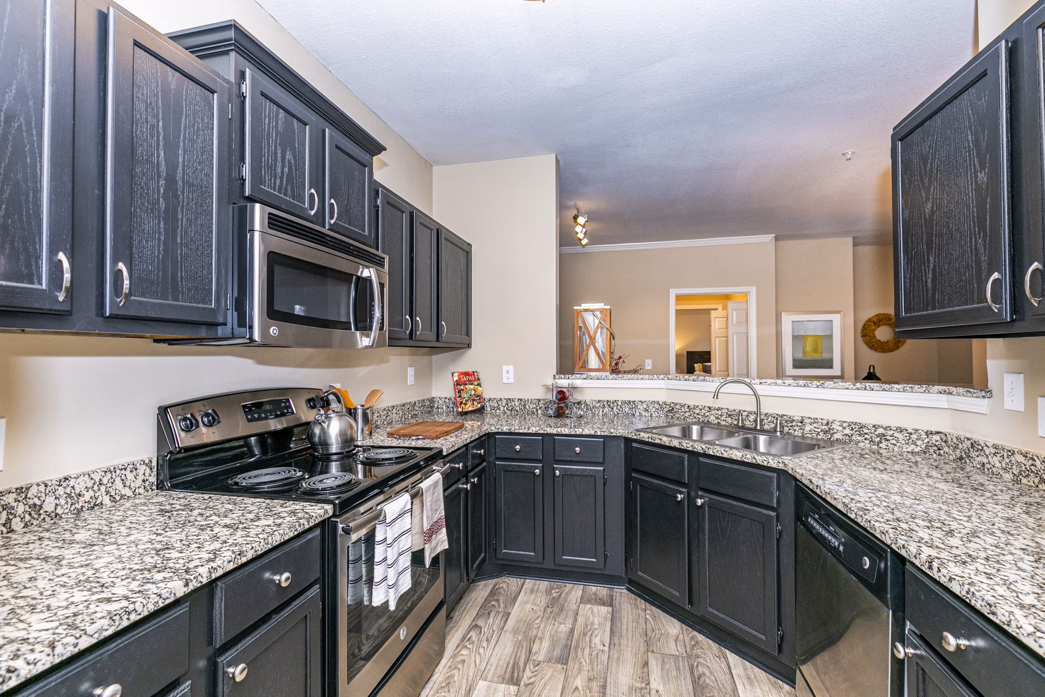Modern kitchen featuring sleek countertops and stainless steel appliances at Andover at Johns Creek luxury apartments