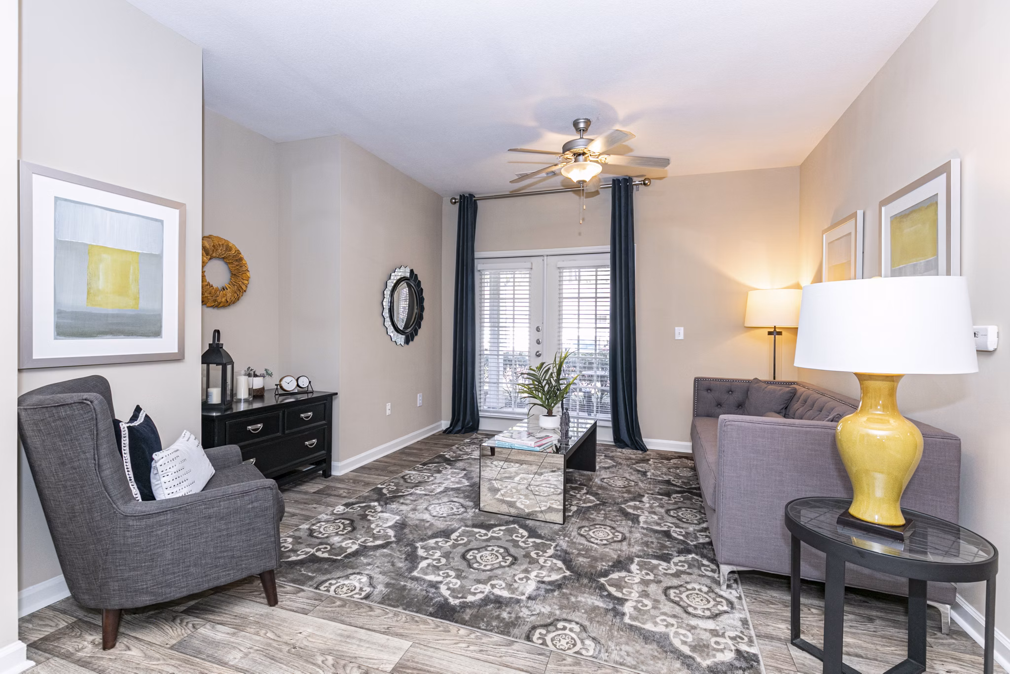 Spacious living room with modern decor at Andover at Johns Creek Apartments