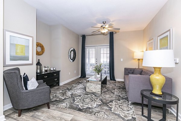 Spacious living room with modern decor at Andover at Johns Creek Apartments